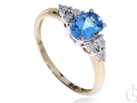 Pierścionek zaręczynowy ze złota pr.0,585 z topazem błękitnym i diamentami